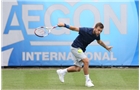 EASTBOURNE, ENGLAND - JUNE 16: Daniel Evans of Great Britain plays a backhand against Tobias Kamke of Germany during their Men's Singles first round match on day three of the Aegon International at Devonshire Park on June 16, 2014 in Eastbourne, England.  (Photo by Steve Bardens/Getty Images)